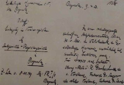 Handgeschriebenes Schreiben in deutscher Kurrentschrift auf vergilbtem Papier, oben rechts das Datum, links die Anschrift an das Amtsgericht Bayreuth.
